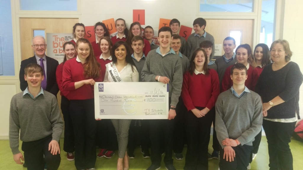 Leitrim Rose Sinead Flynn receiving a donation from SUITS bank